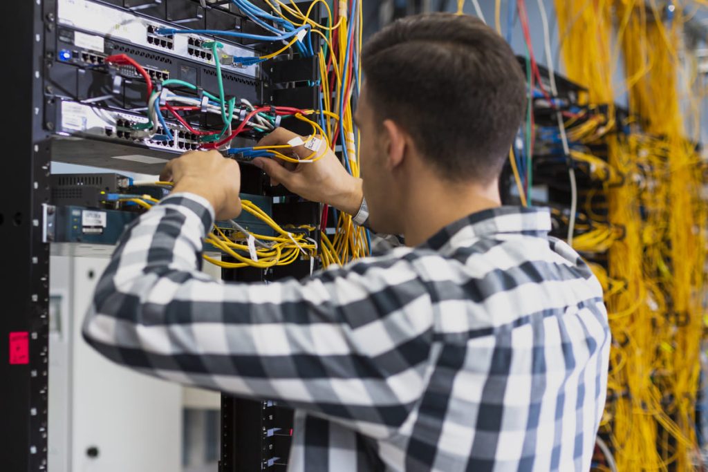 young-man-working-ethernet-switch